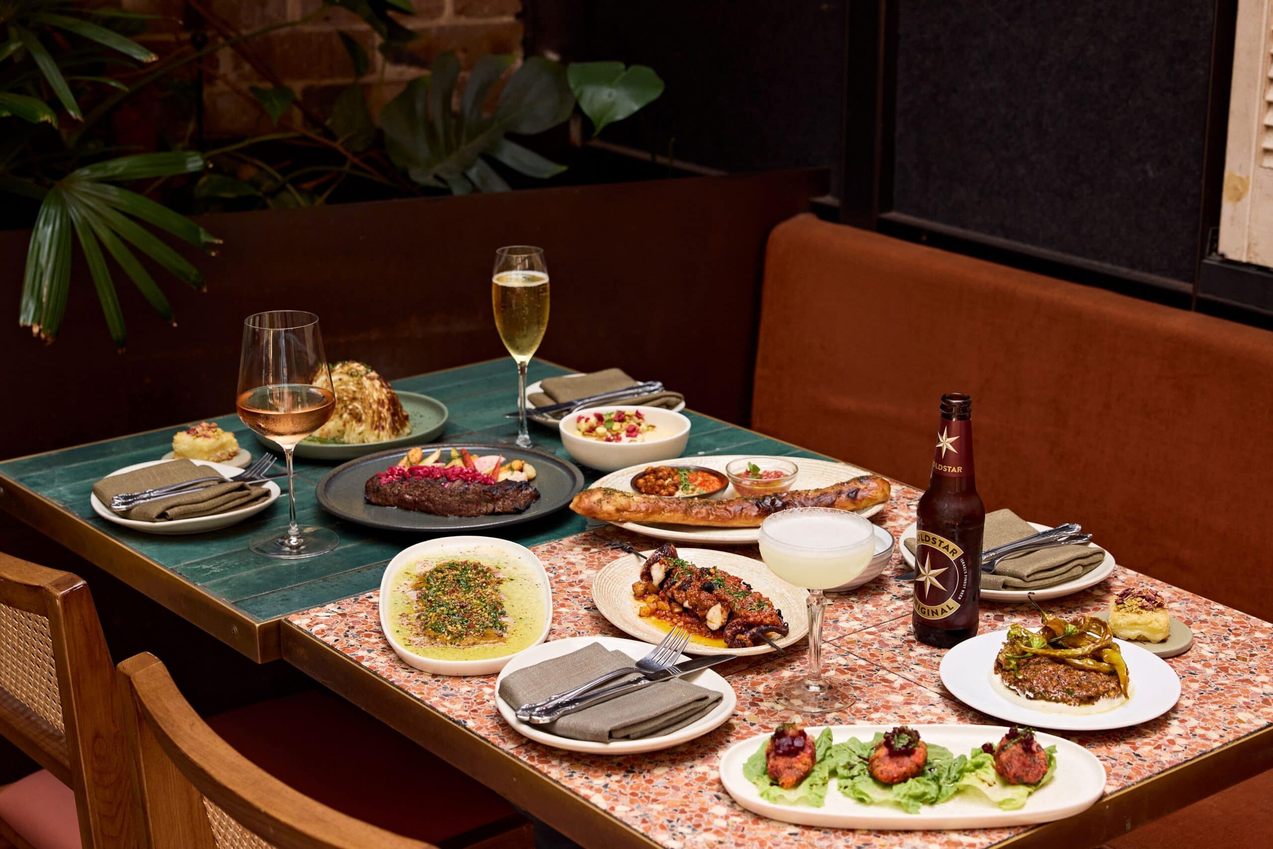 Mezze spread with grilled octopus charred steak kubaneh bread hummus and share plates at Shaffa Surry Hills Sydney