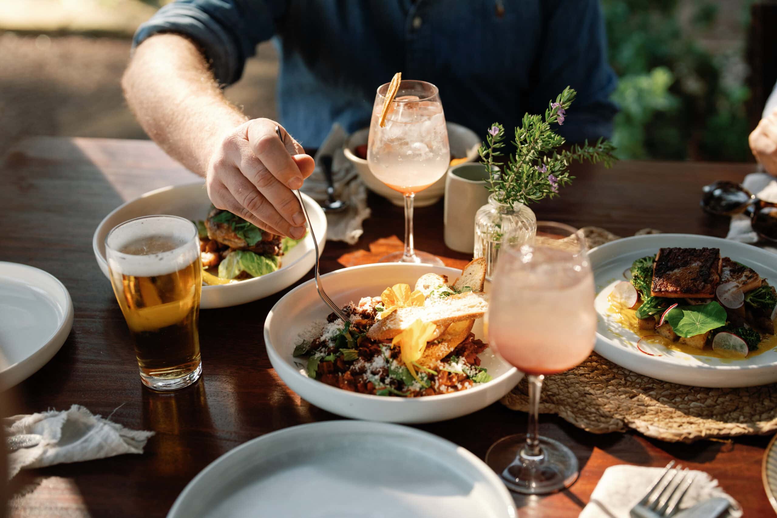 A table full of food and drink at 11 Acre Farm