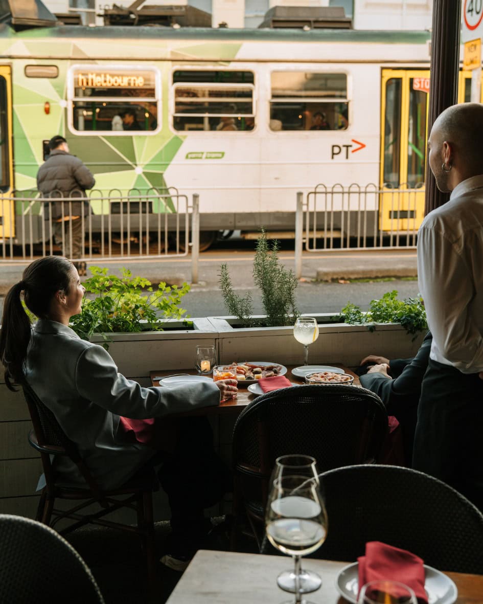 View of a Melbourne tram from dining room at Bar Taralli, North Melbourne.