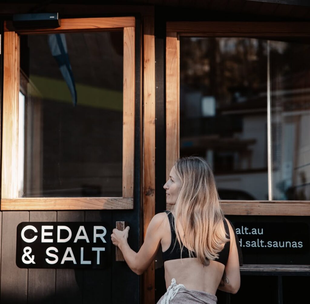 Woman Walking into The Cedar & Sault Sauna, Manly Wharf