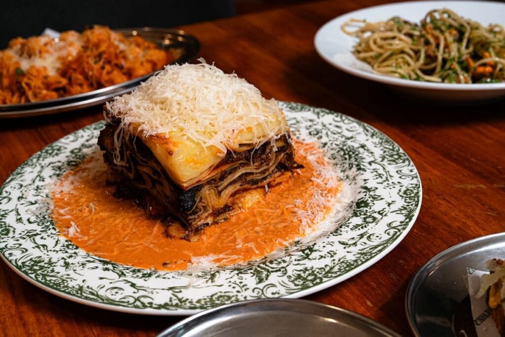 Beef shin lasagne topped with parmesan and served over vodka sauce at Sippenham, Sydenham, Sydney