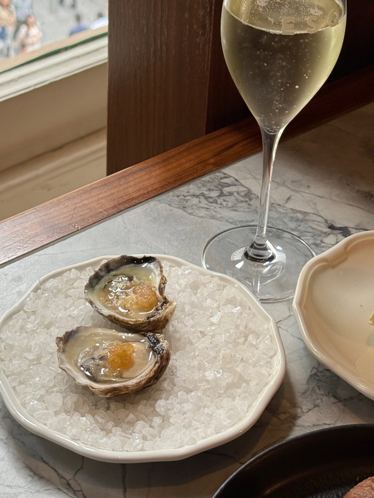 oysters and champagne at the bar at ESQ at the QVB