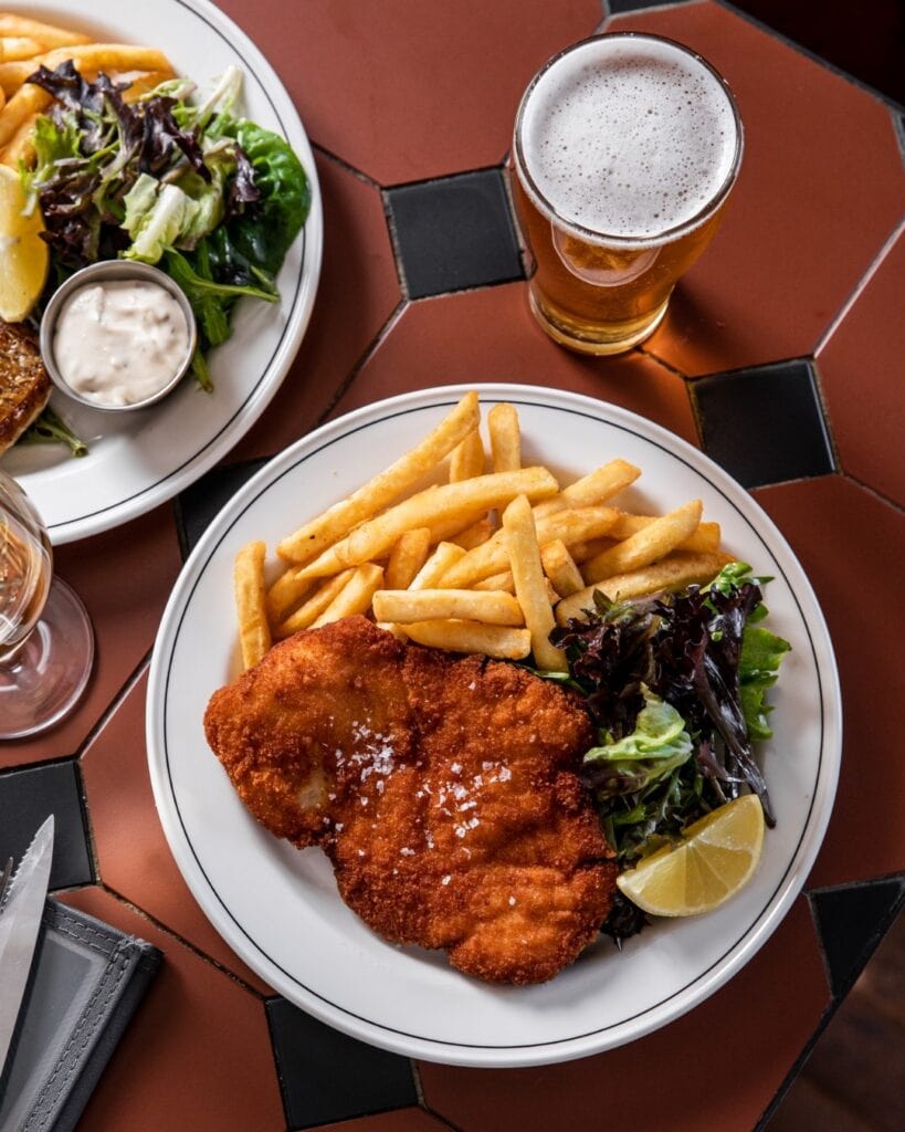 Chicken schnitzel with fries and salad at Forresters Surry Hills Sydney