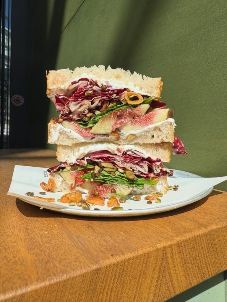 Sandoochie stacked sandwich with fig radicchio brie and pumpkin seeds on white bread No Name Lane Sydney CBD