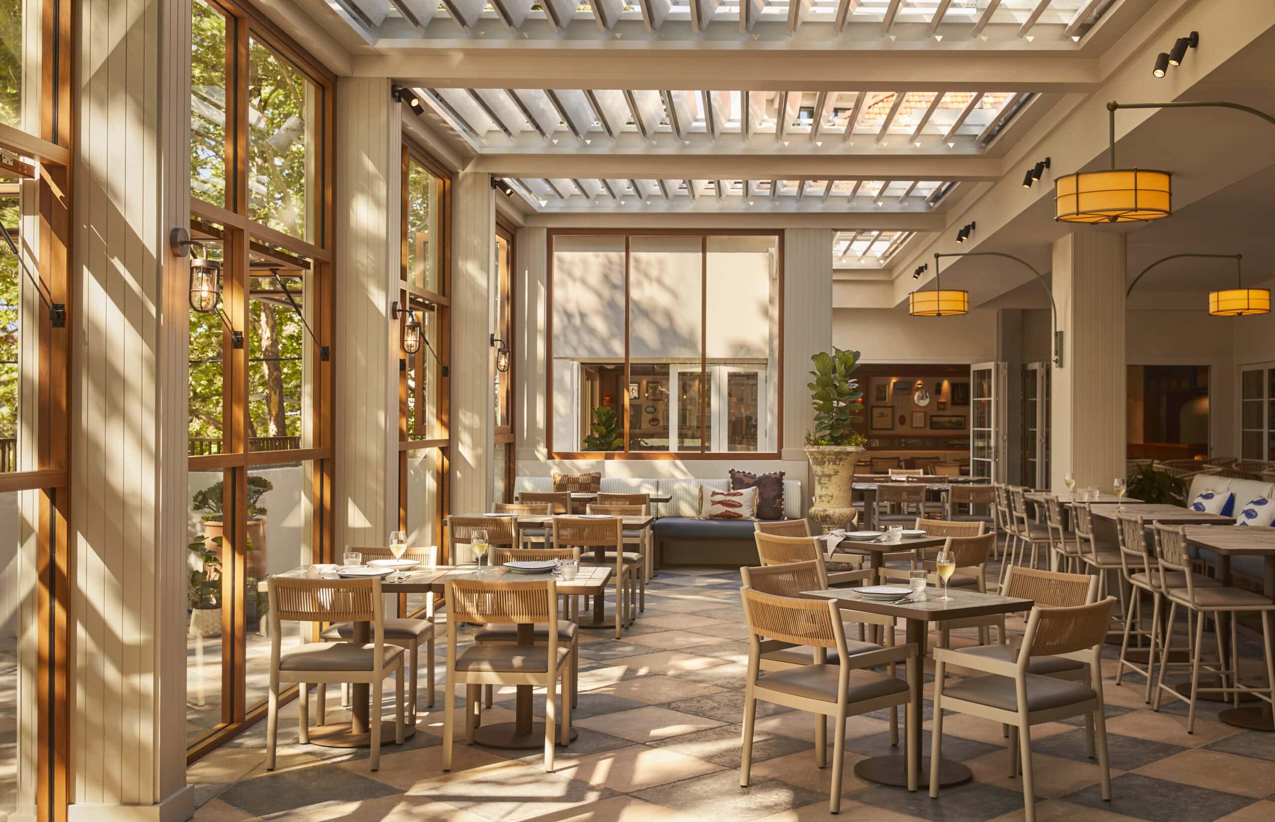 Sunlit terrace dining area with pergola roof timber joinery and pendant lights Old Commodore Hotel McMahons Point Sydney