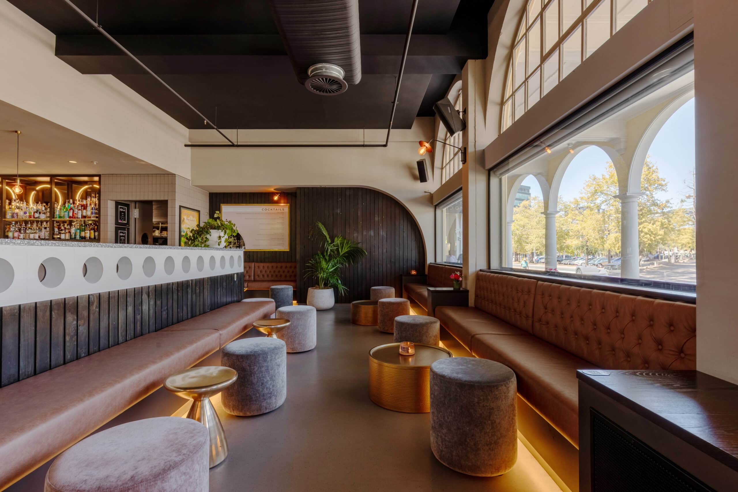 interior shot of luna bar canberra with arch windows and expansive bar area