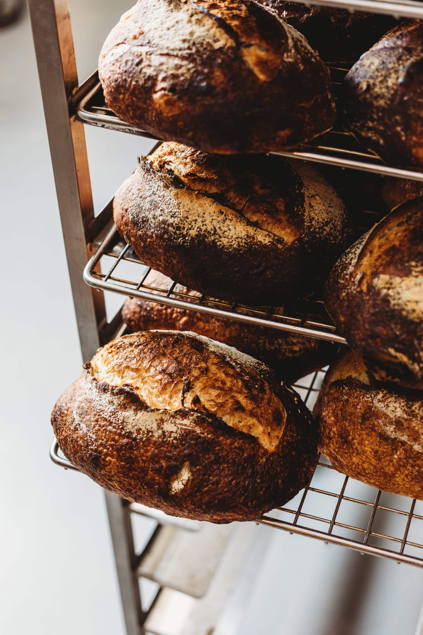 Fresh sourdough loaves cooling on rack at Little Sutton Bakehouse Deakin Canberra
