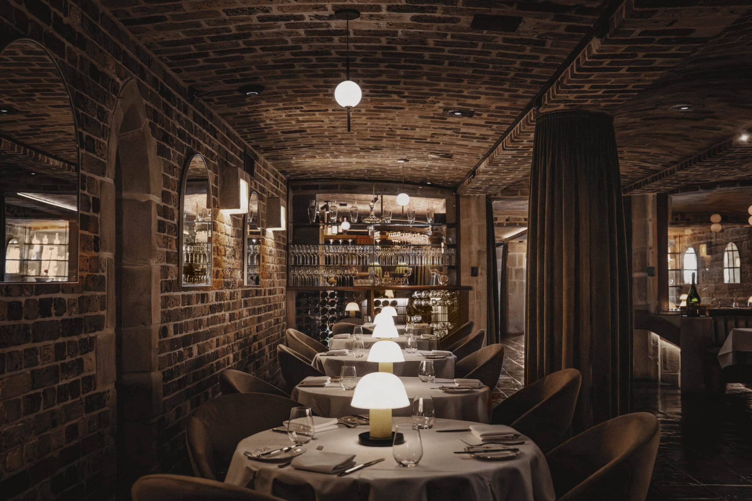 moodily lit interiors in the main dining room at darling glebe