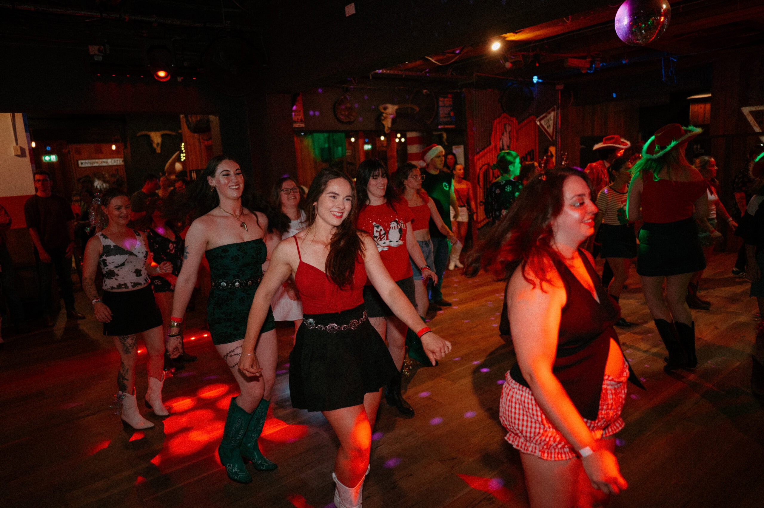 People line dancing at Saddle & Stomp event in Adelaide.