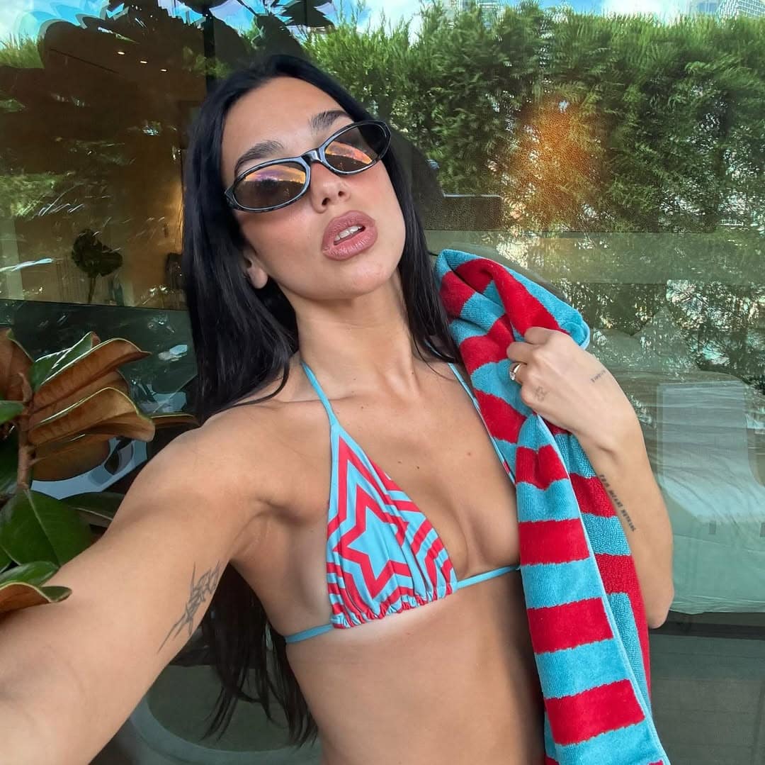 dua lipa posing in a red and blue star bikini in sydney australia