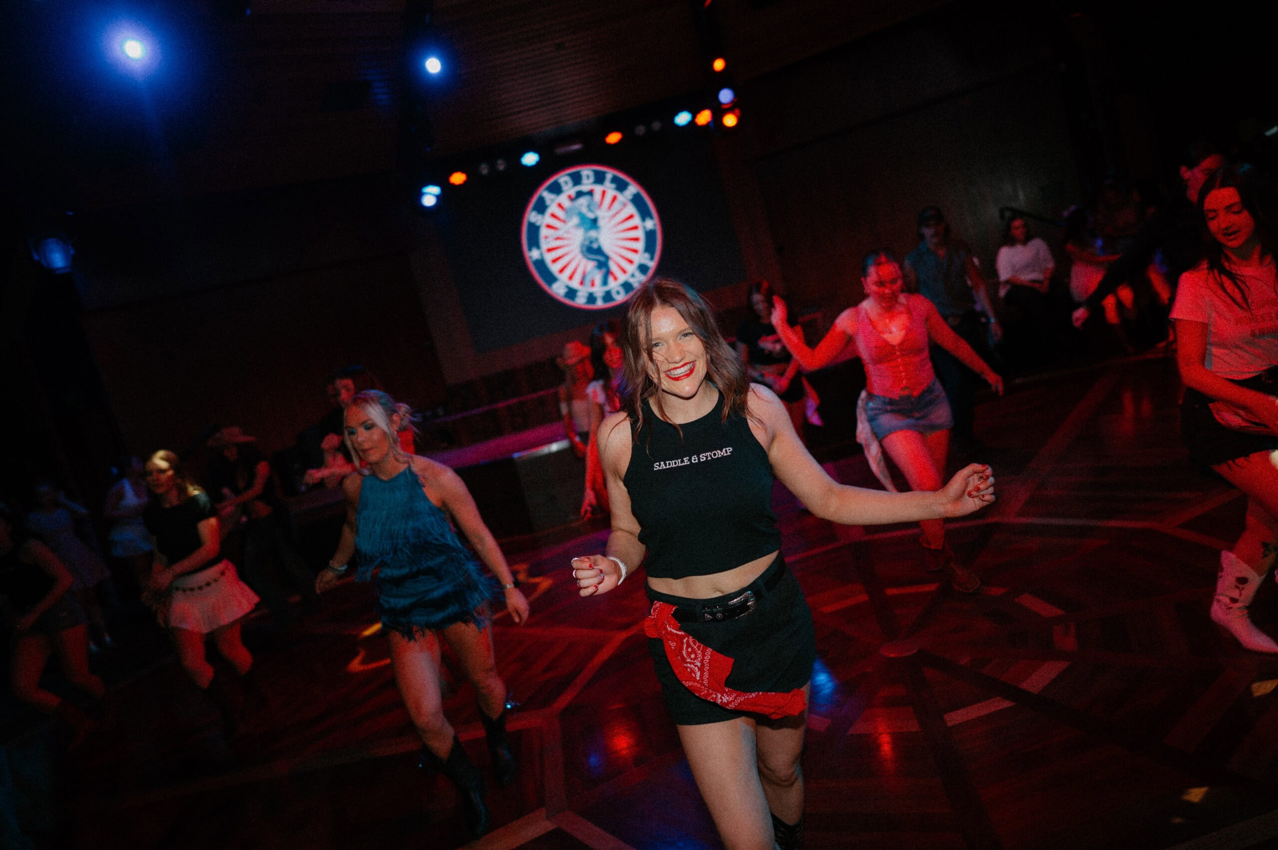 People line dancing at Saddle & Stomp event in Adelaide.