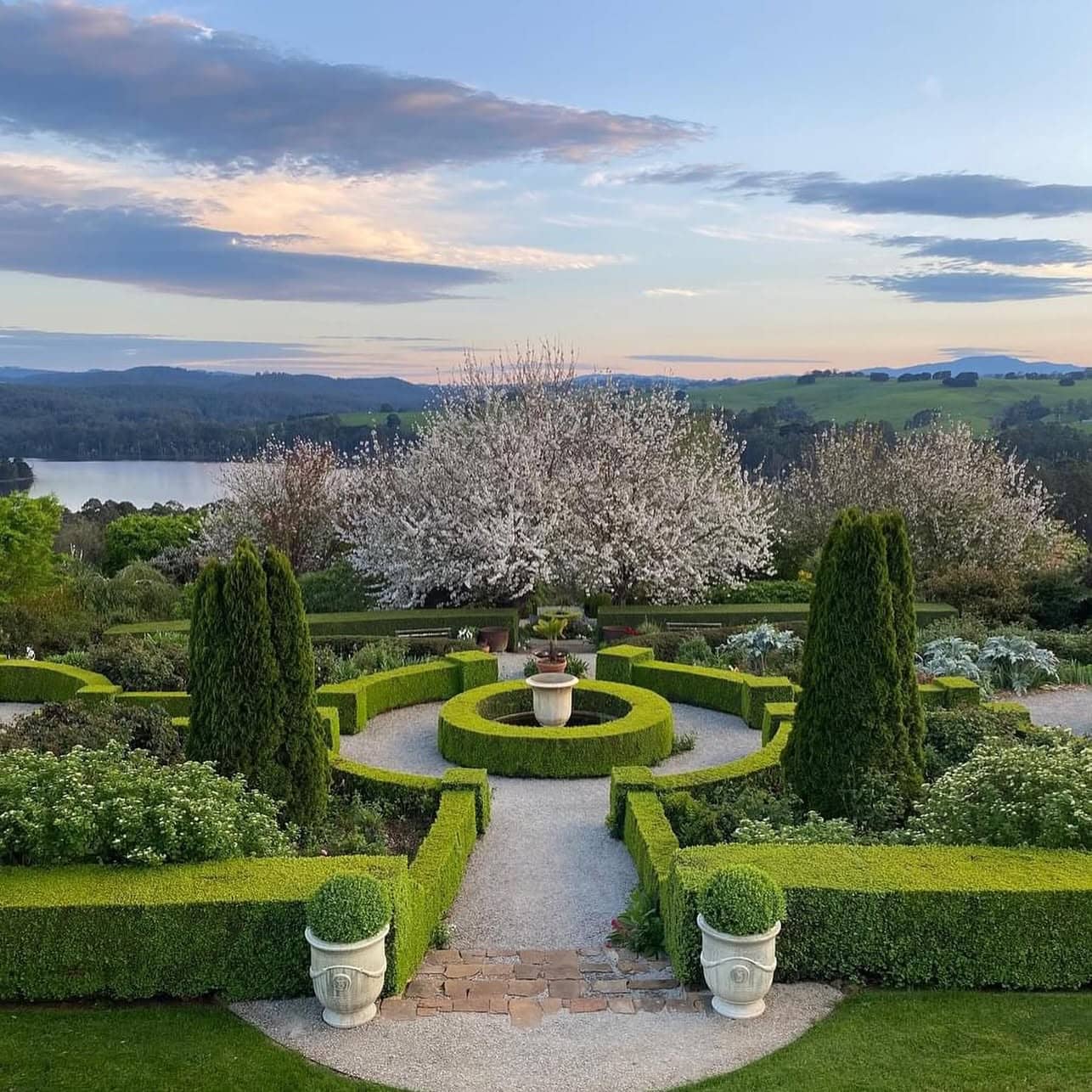broughton hall garden gippsland at dusk with lake in the background