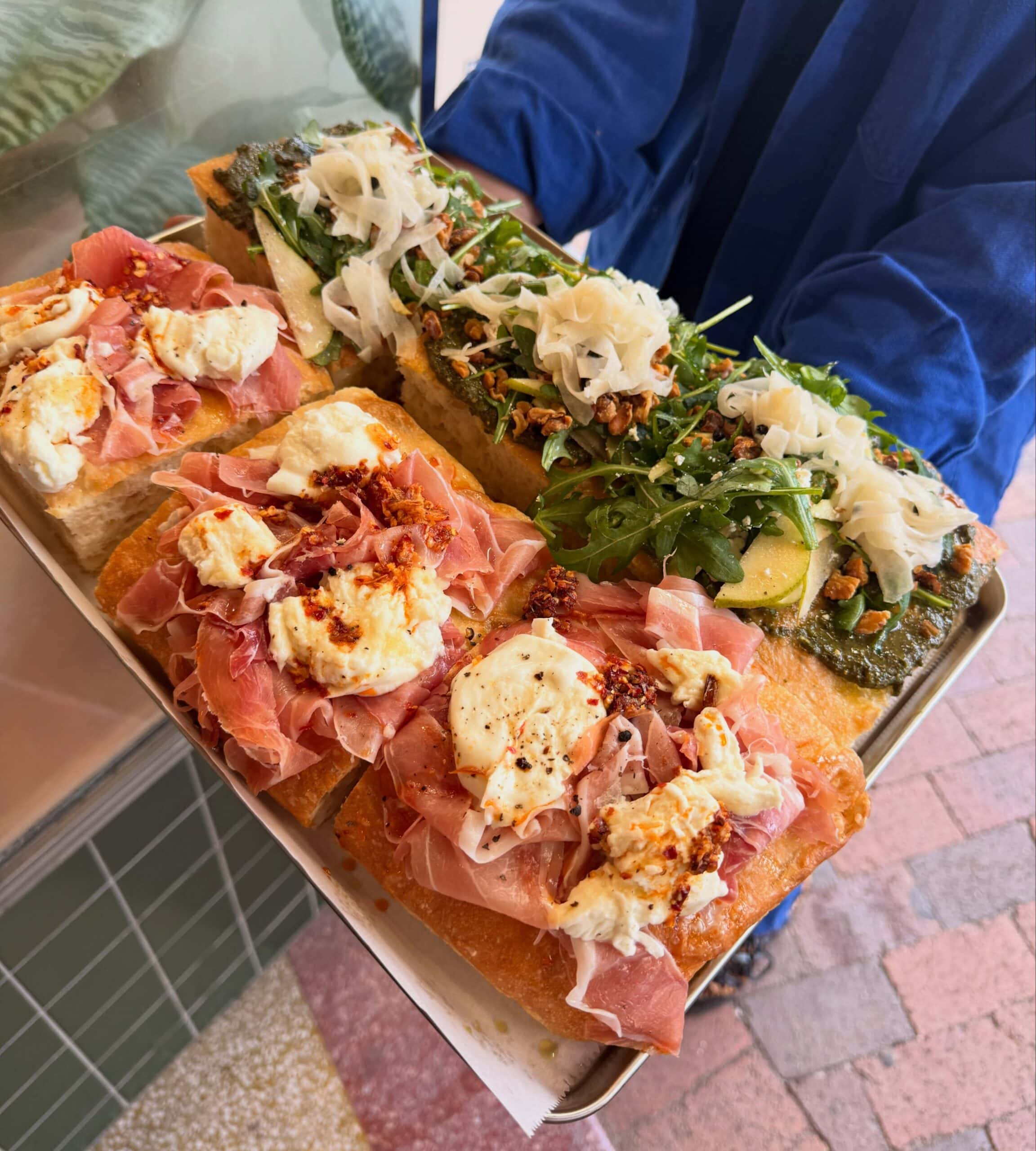 Topped focaccia with prosciutto, mozzarella and pesto pear at Butter Wentworth Falls NSW