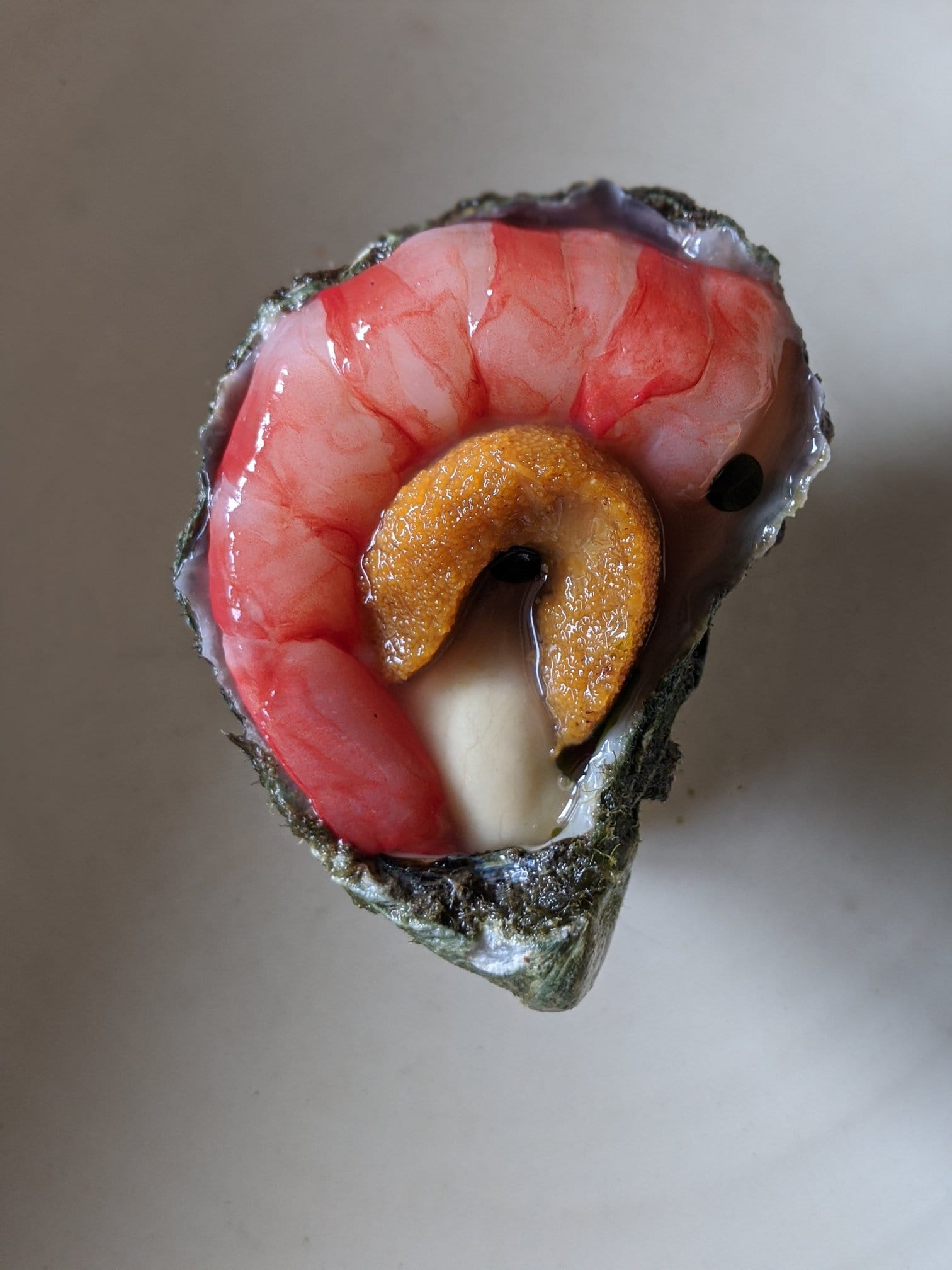 A prawn inside an oyster shell at innovative seafood restaurant Saint Peter in paddington.