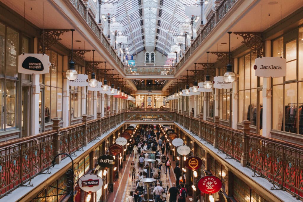 The triple-level historic Strand arcade with hanging shop signs in Sydney's CBD. 