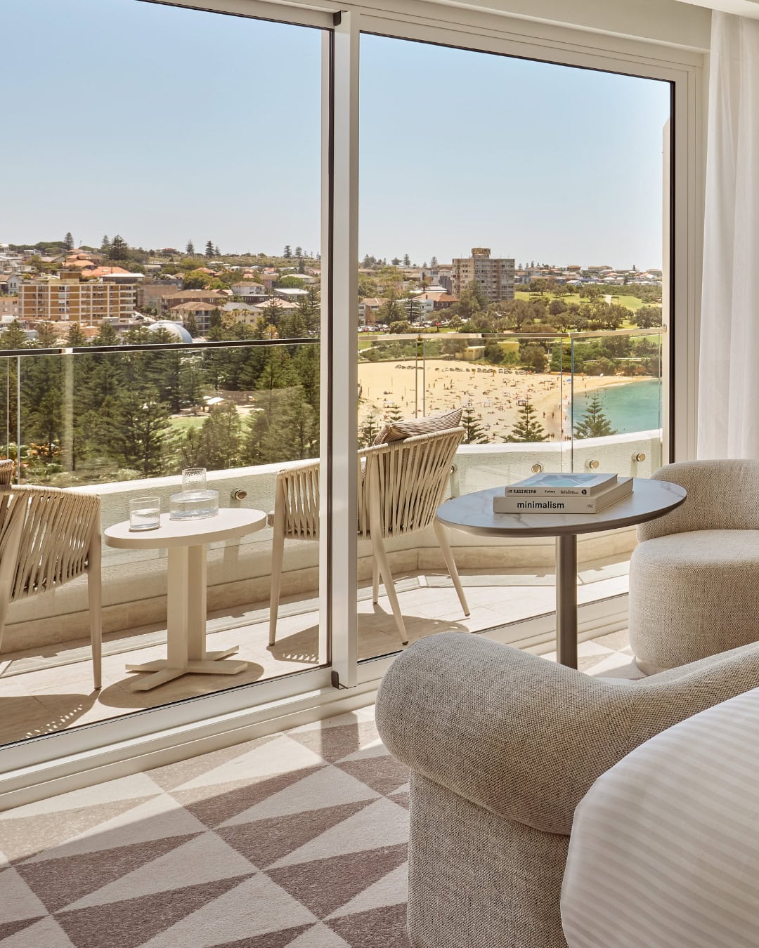 A serene beige loungeroom within one of the rooms at Intercontinental Coogee.
