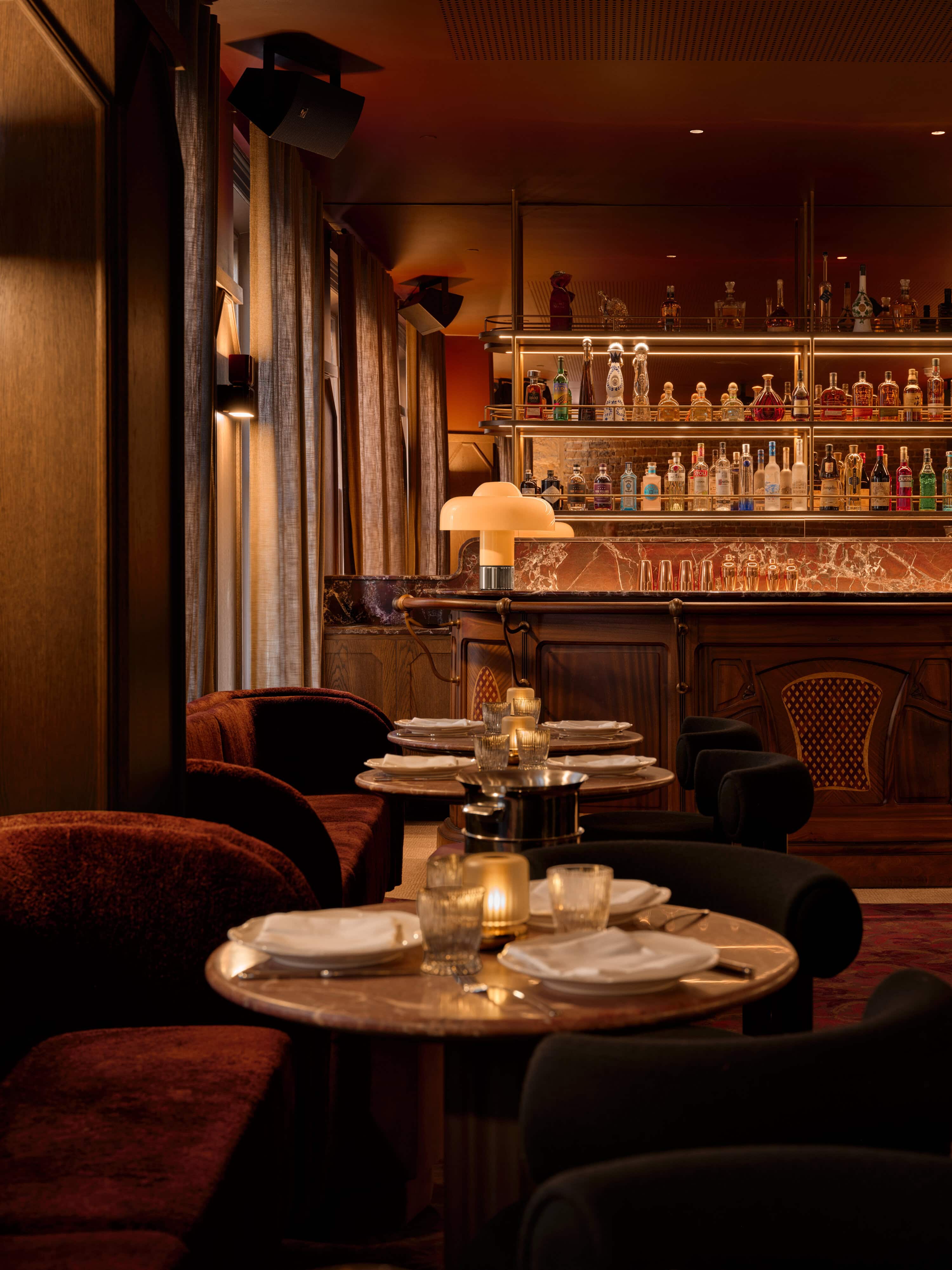 interior shot of charlies bar upstairs at grappa the rocks with moody lighting and wooden furniture