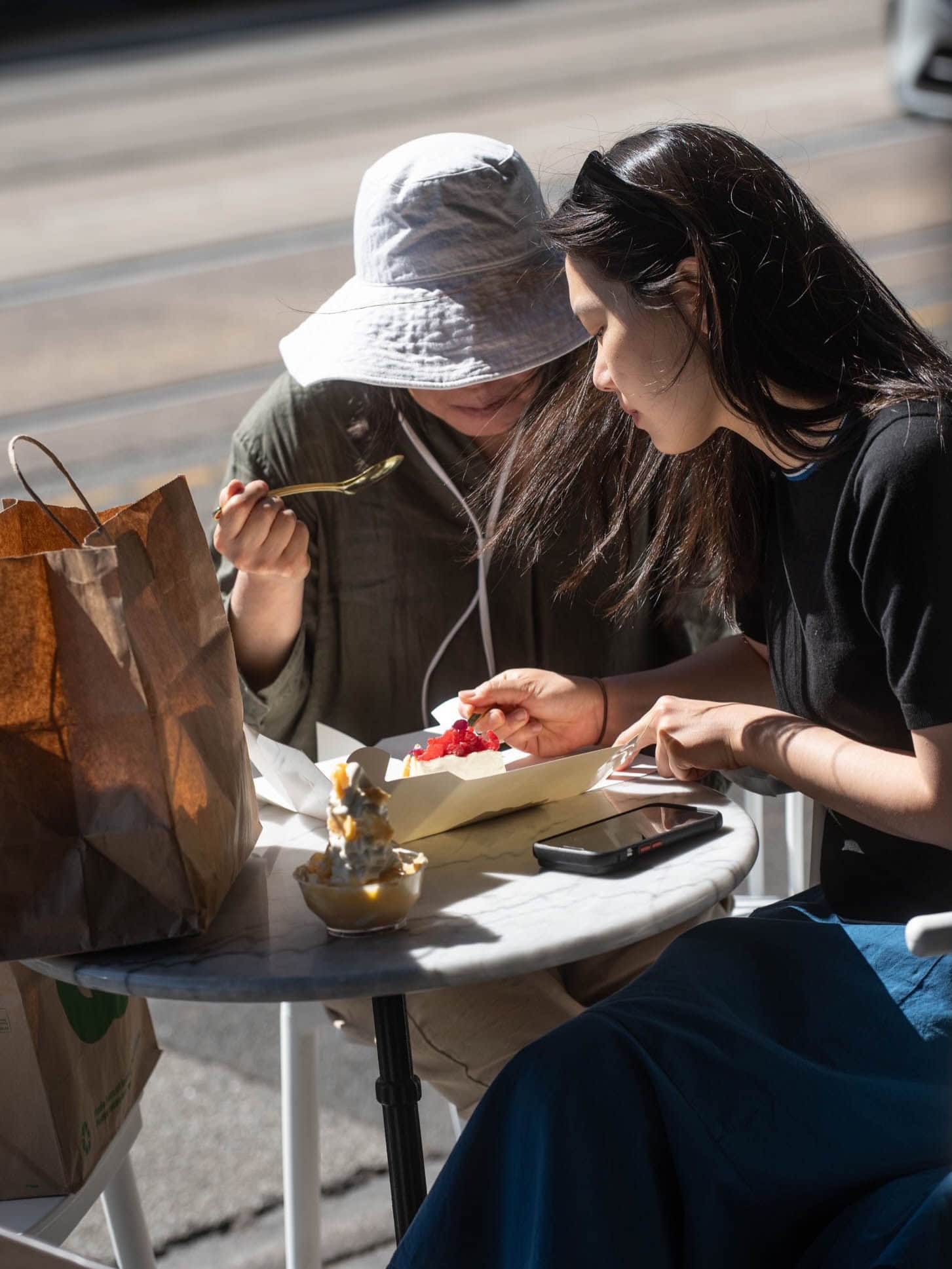 Customers enjoying cake and dessert outside Mietta by Rosemary in Malvern, Melbourne.