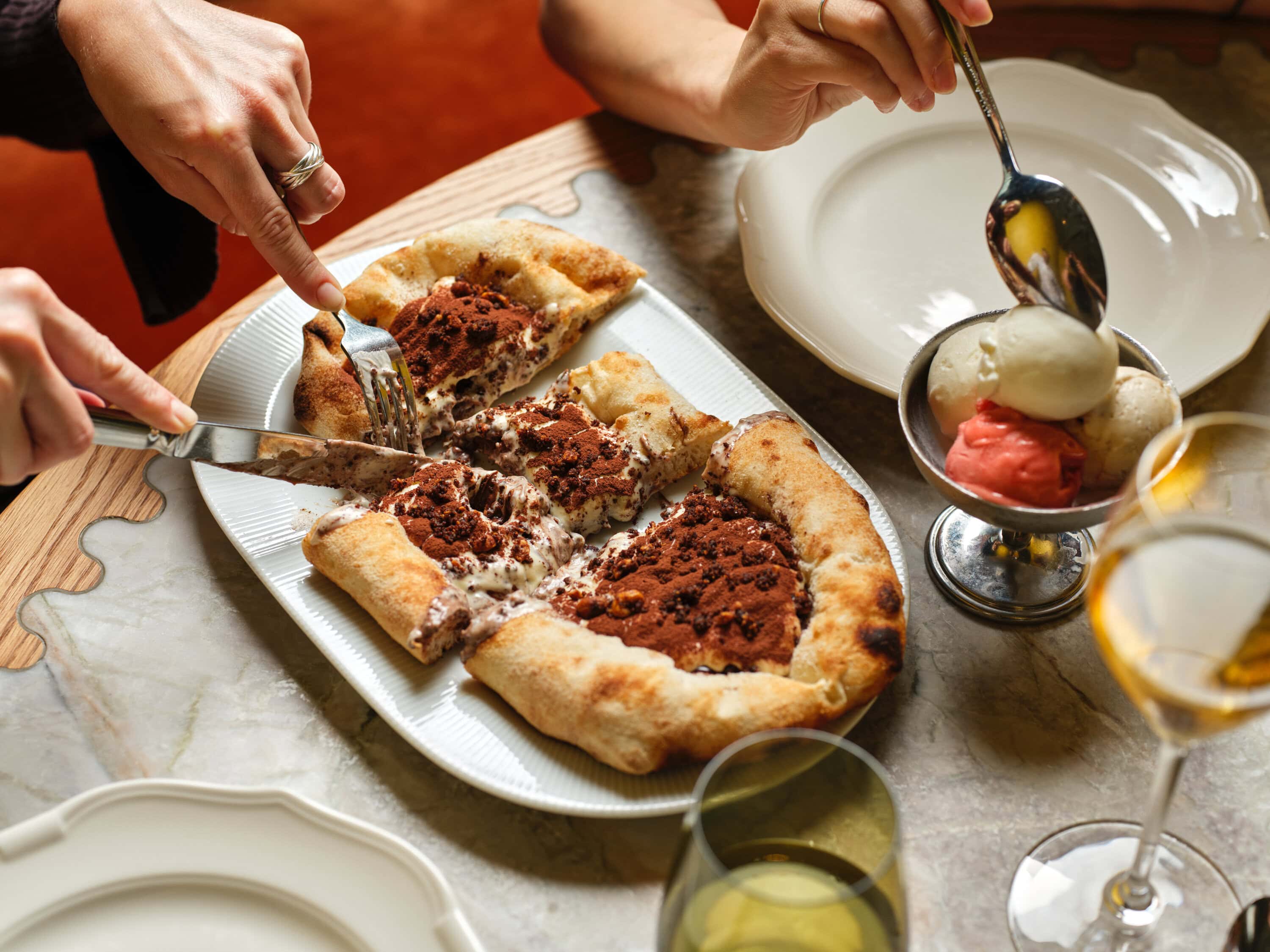 an aerial shot of the tiramisu pizza and three gelato scoops at pizza'mare