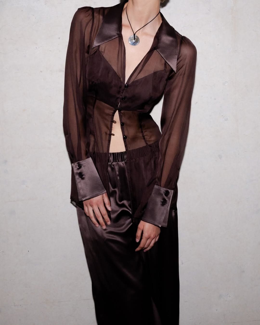 jillian boustred long sleeve brown sheer top with brown silk skirt