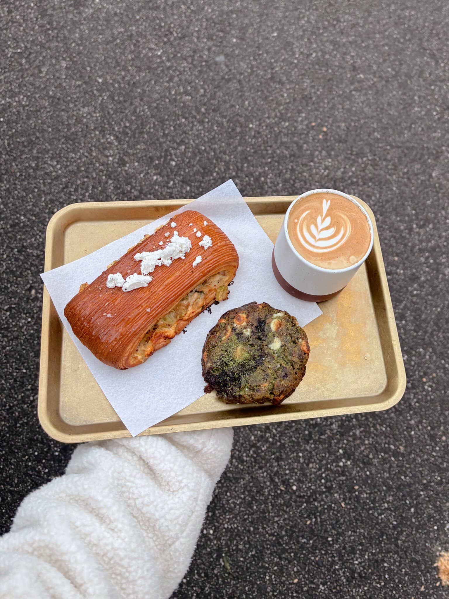 Savoury pastry, baked treat and latte from Amann Patisserie in Carlton North, Melbourne.