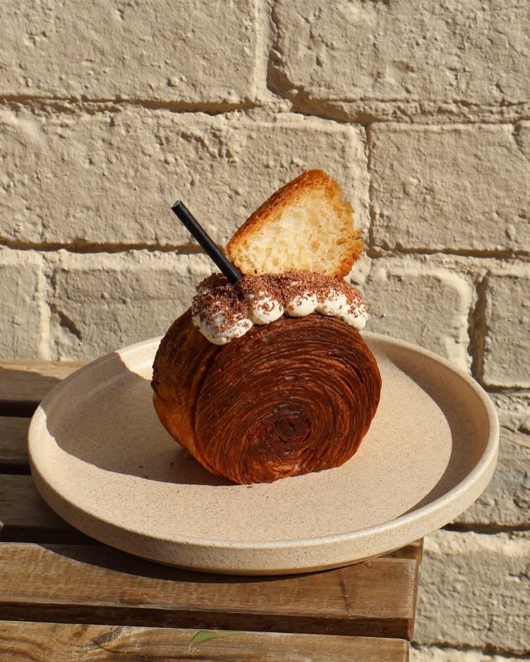 Calle Bakery croissant wheel topped with cream, cocoa and crisp pastry at the Melbourne bakery.
