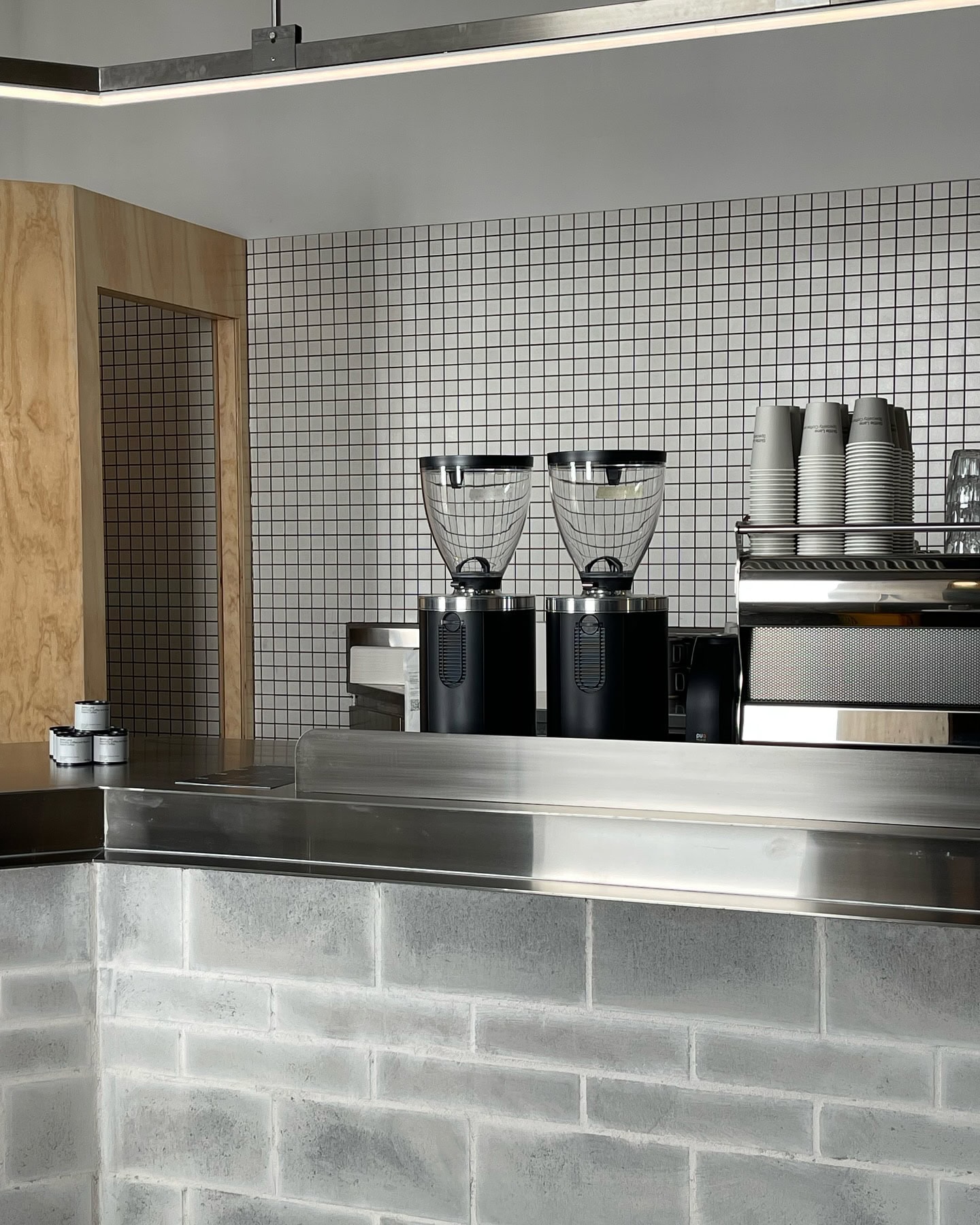 The sleek industrial interiors of skittle lane, featuring their coffee machine and double hoppers.