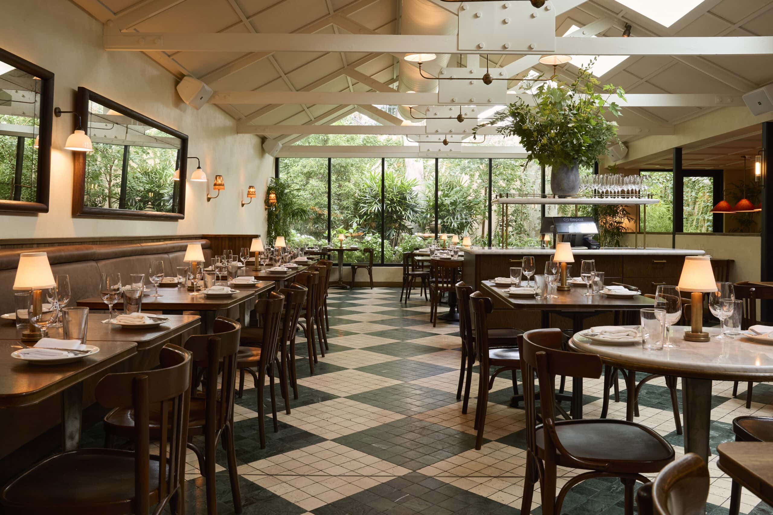 Dining room interior with checkered tile floors and garden views at The Dry Dock Balmain Sydney