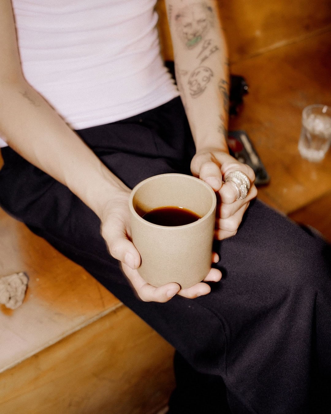 Someone holding a cup of filter coffee at skittle lane in sydney.