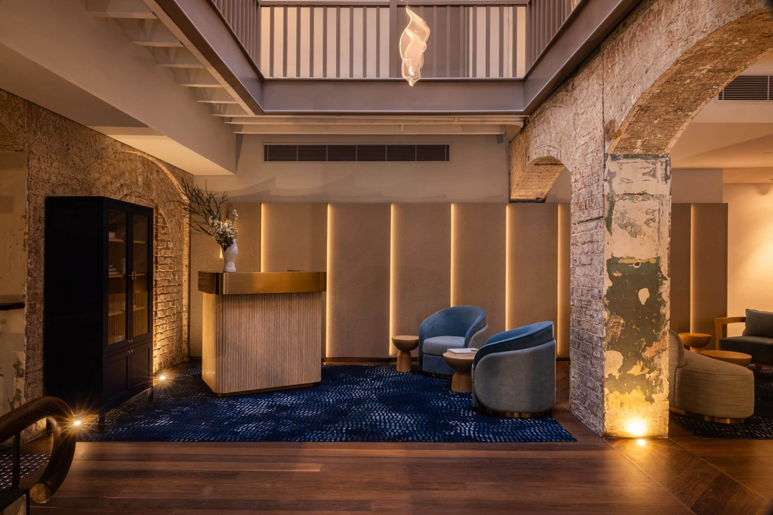 Lobby reception with exposed brick archways at Harbour Rocks Hotel The Rocks Sydney