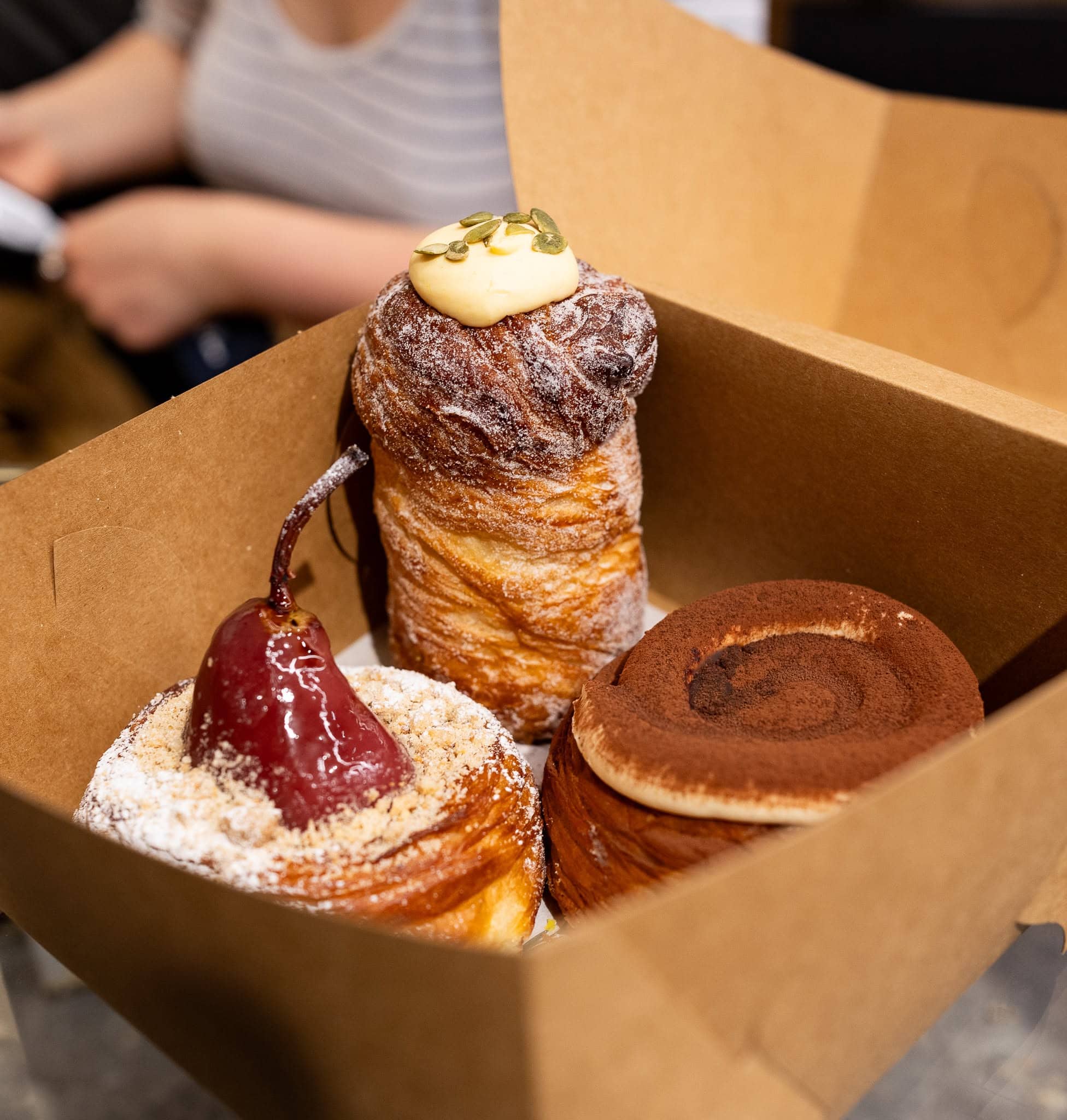Assorted French pastries in a takeaway box from Publique Bakery in Melbourne.