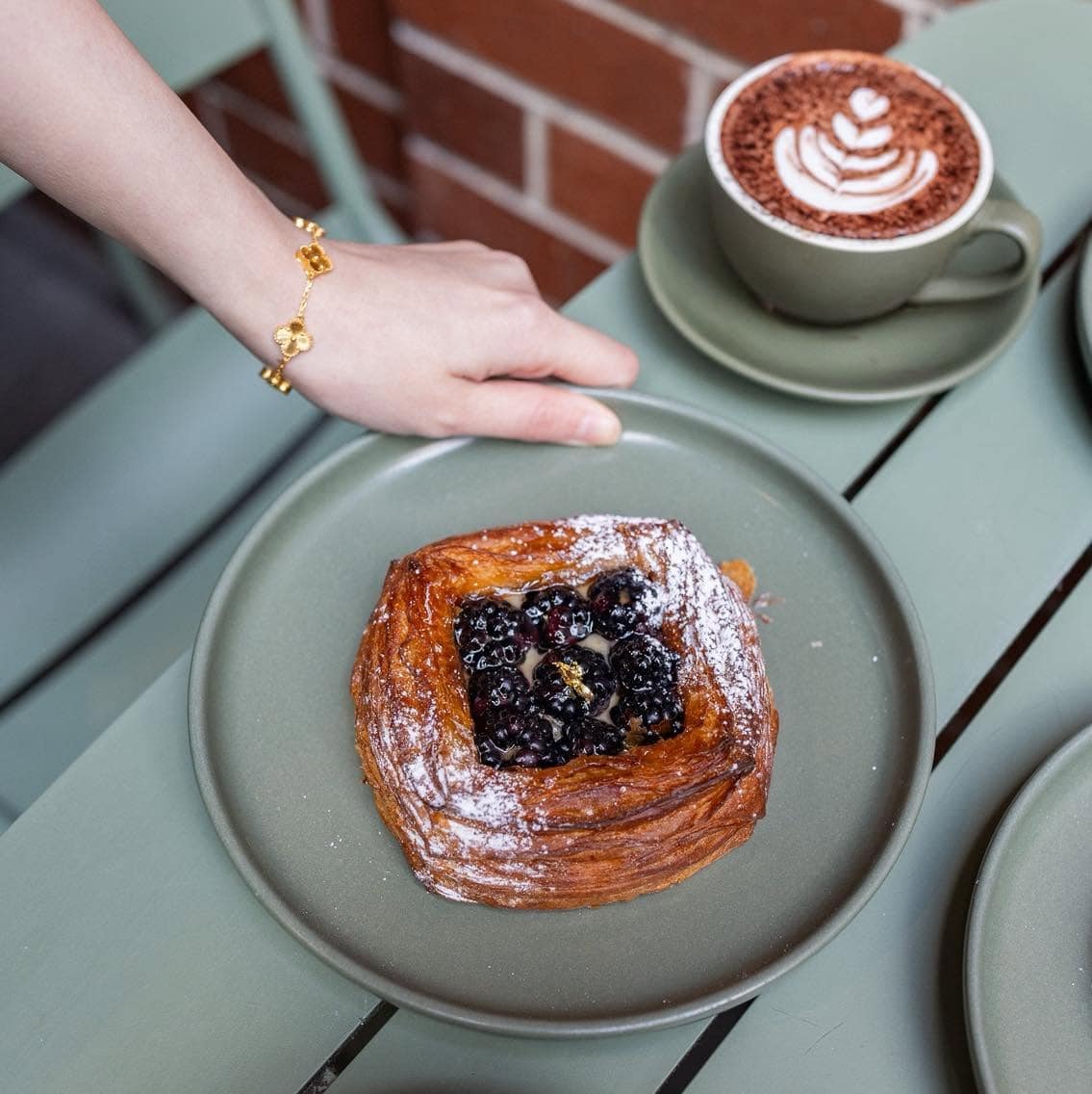 Blackberry danish served with coffee at Publique Bakery in Melbourne.