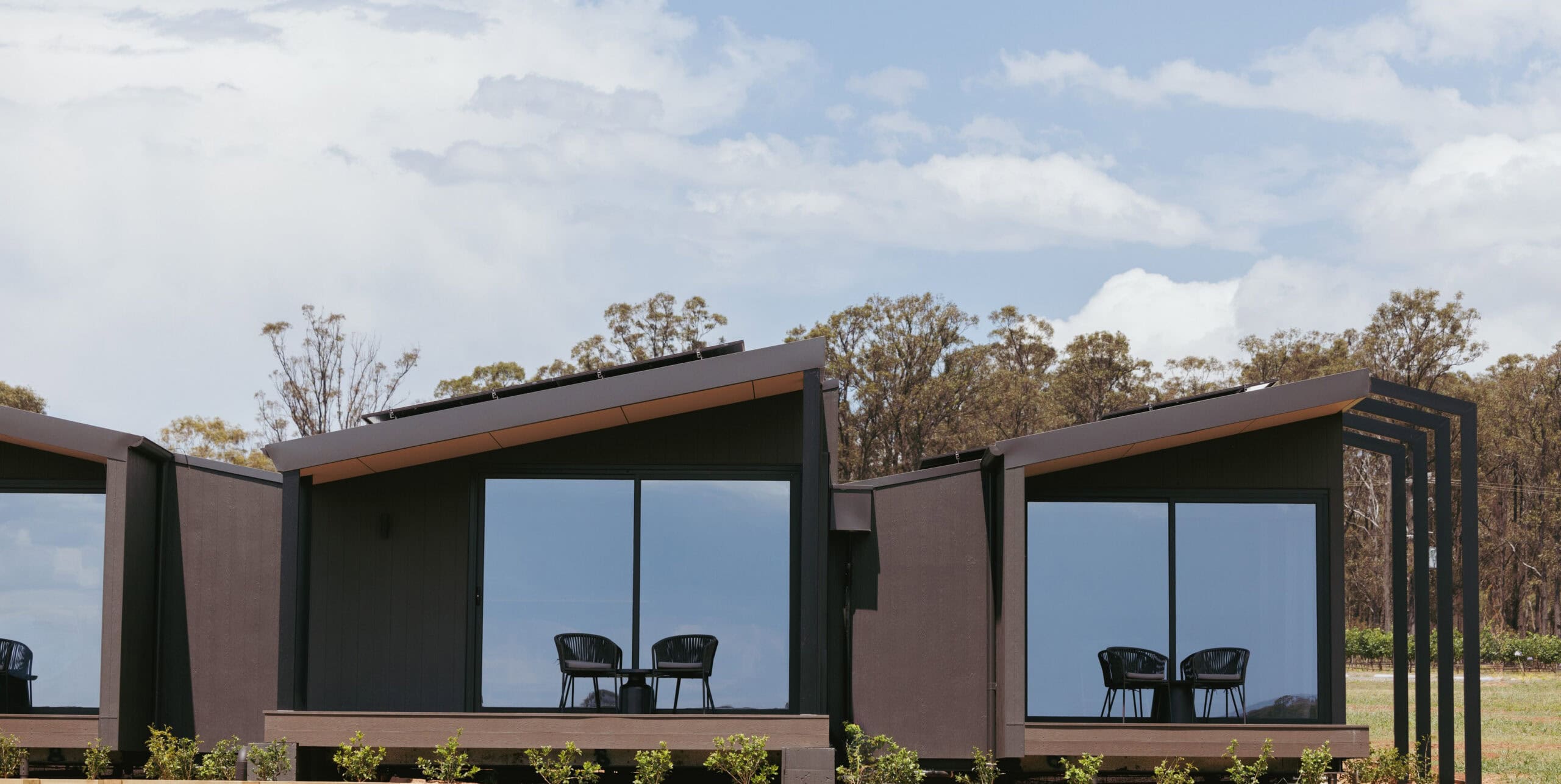 Studio retreat exterior with outdoor deck and vineyard views at The Lane Retreat Pokolbin Hunter Valley