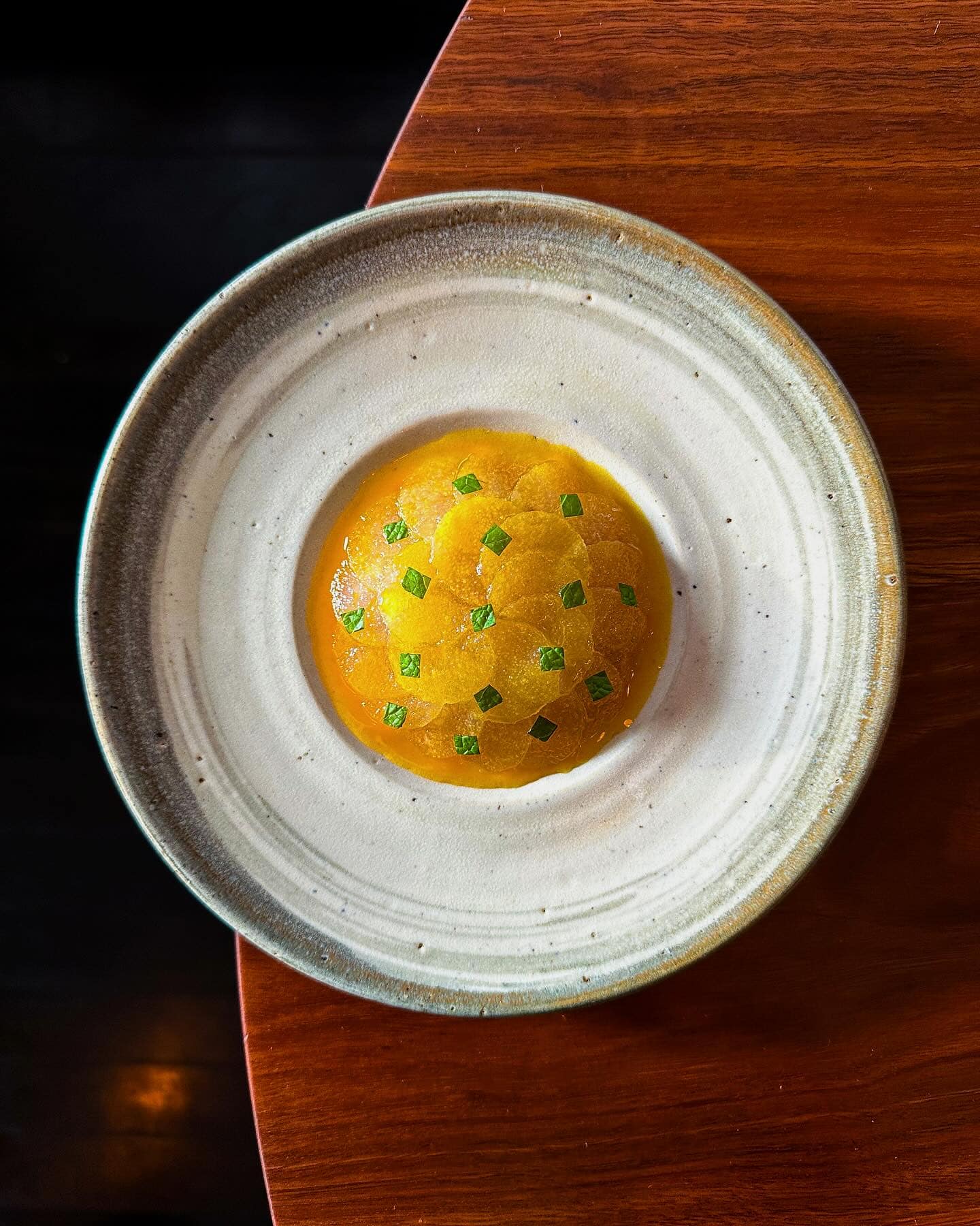 A plate or artfully presented travally sashimi in a ceramic bowl from sixpenny in Sydney.