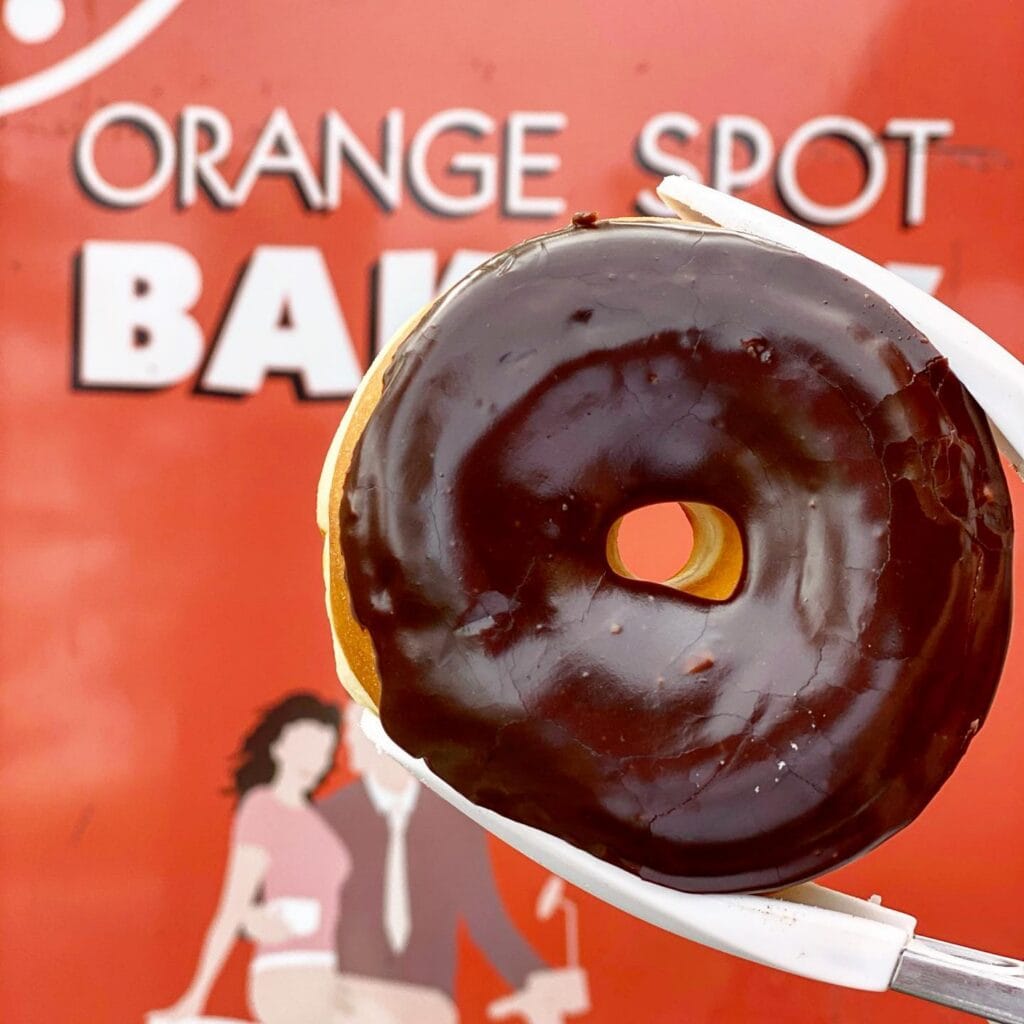 Chocolate iced donut from Orange Spot Bakery in Adelaide.