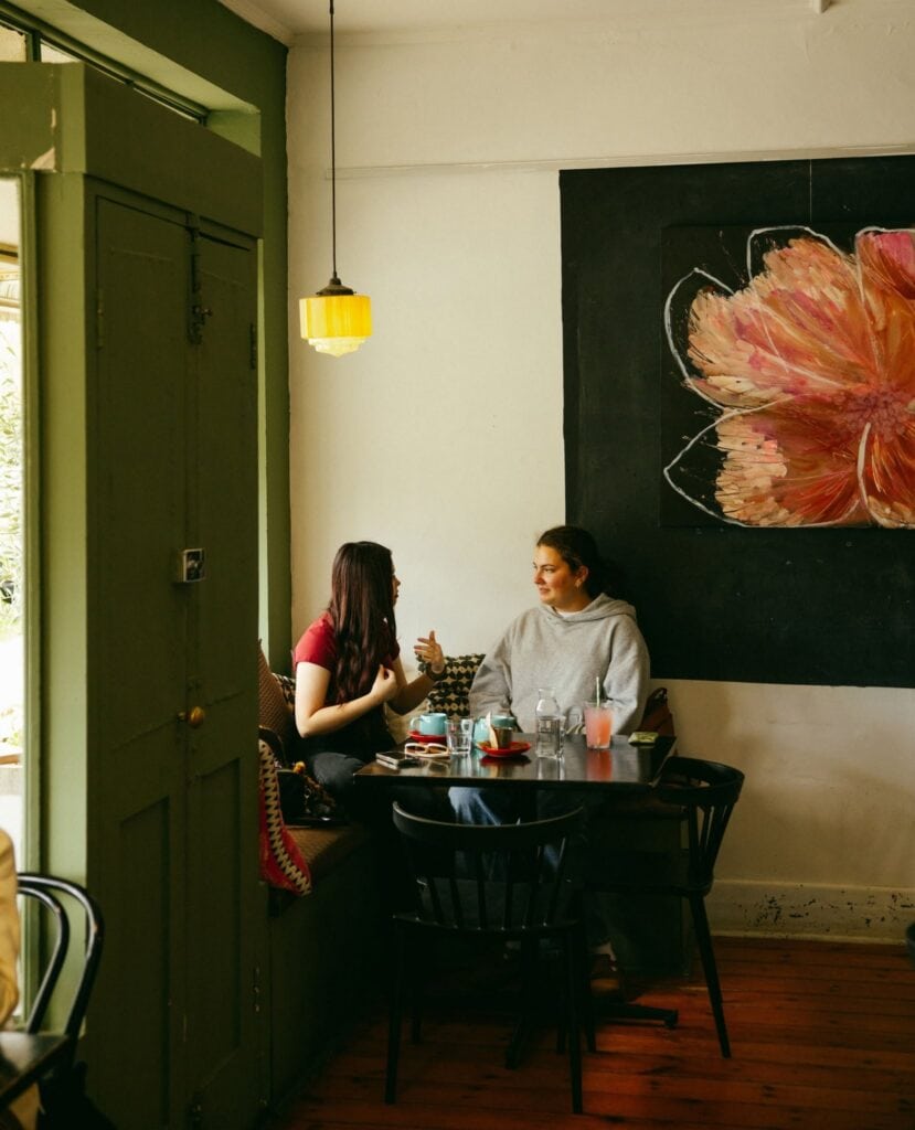 Two people dining at Local Crowd cafe in Adelaide.