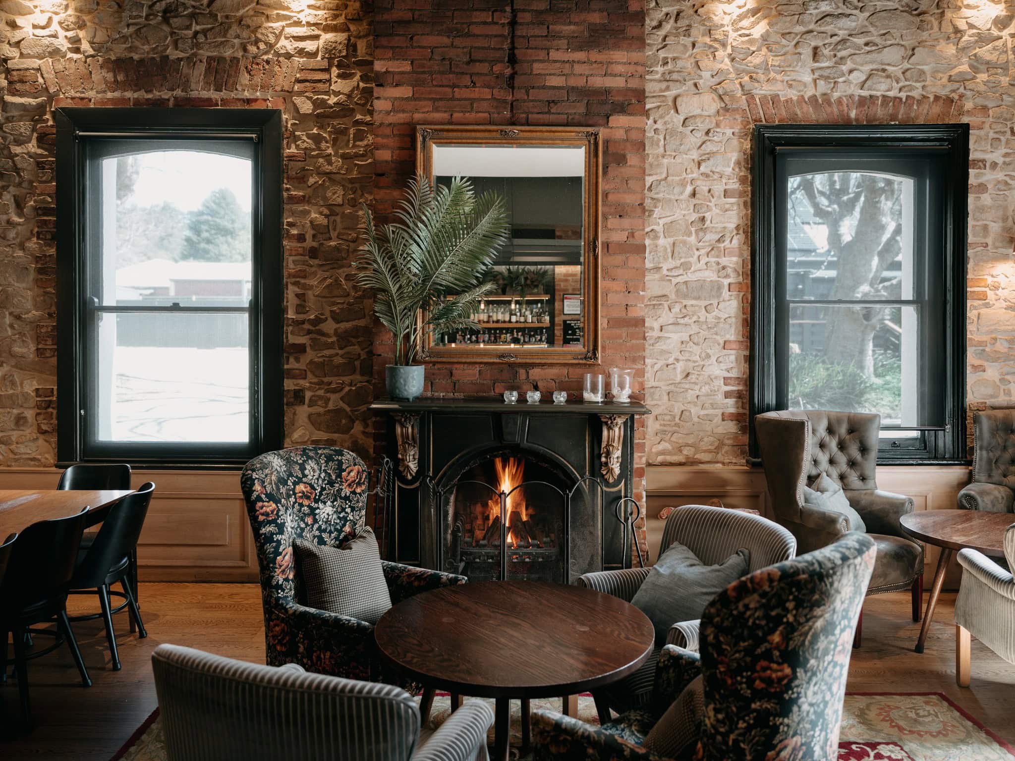 10:29 AMClaude responded: Cosy lounge bar at Crafers Hotel, Adelaide, with a crackling fireplace, mismatched vintage armchairs, and exposed sandstone and brick walls.Cosy lounge bar at Crafers Hotel, Adelaide, with a crackling fireplace, mismatched vintage armchairs, and exposed sandstone and brick walls.