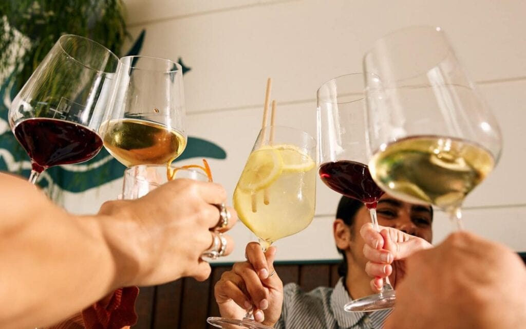 Cheers with cocktails and wine at Bar Lune in Adelaide.