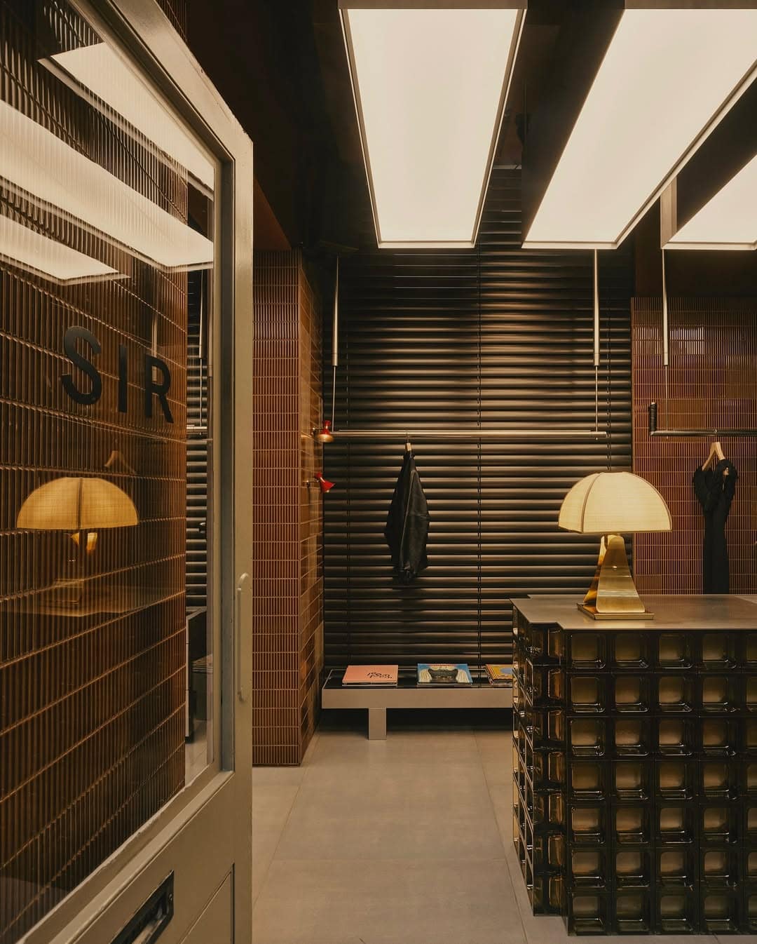 SIR fashion store interior glass block counter with brass lamp Strand Arcade Sydney CBD