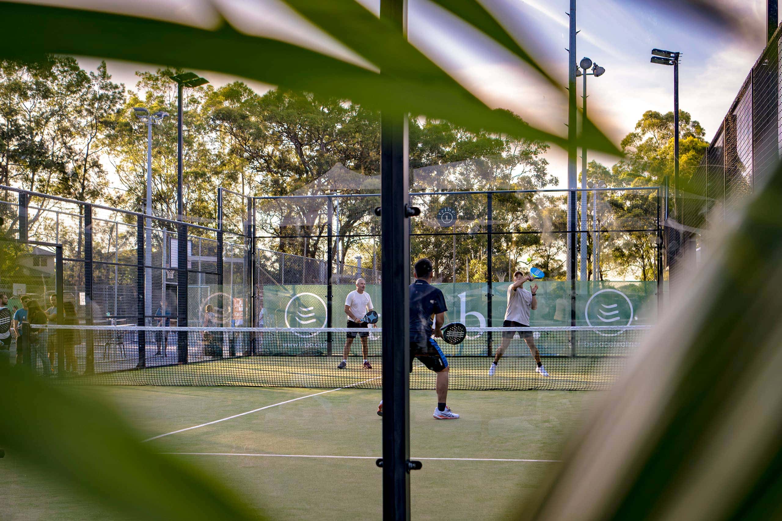Players playing padel at Tribe Padel and Wellness.
