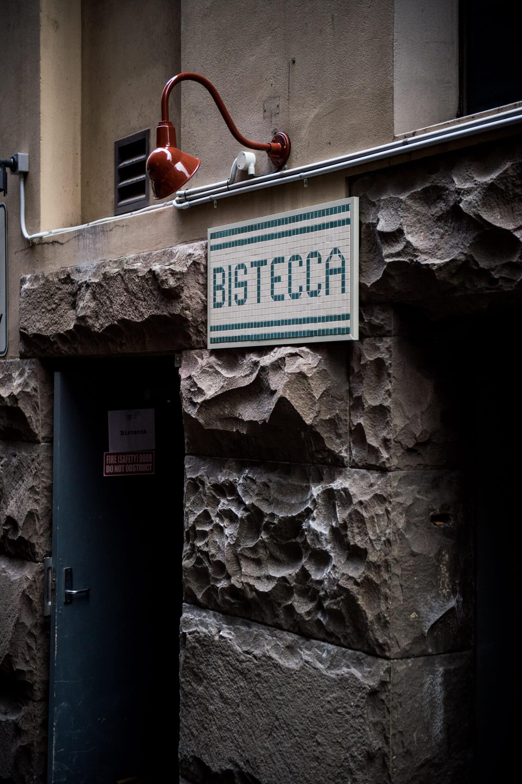 Bistecca mosaic tile signage above laneway entrance Sydney CBD