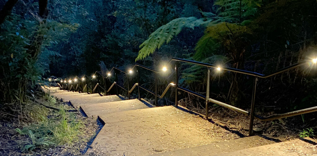 Illuminated staircase along the Katoomba Falls Night-Lit Walk Blue Mountains NSW