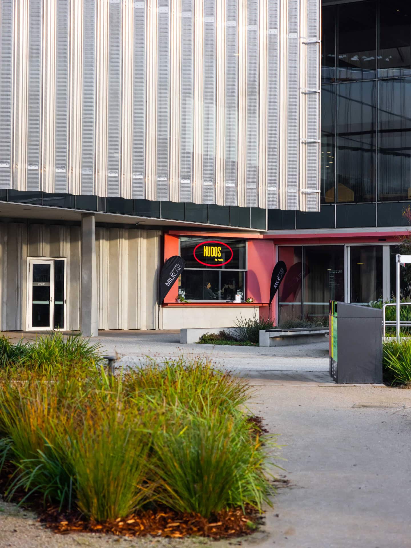 Kudos by Parla kiosk at The Shed in Launceston, framed by native landscaping and modern architecture.