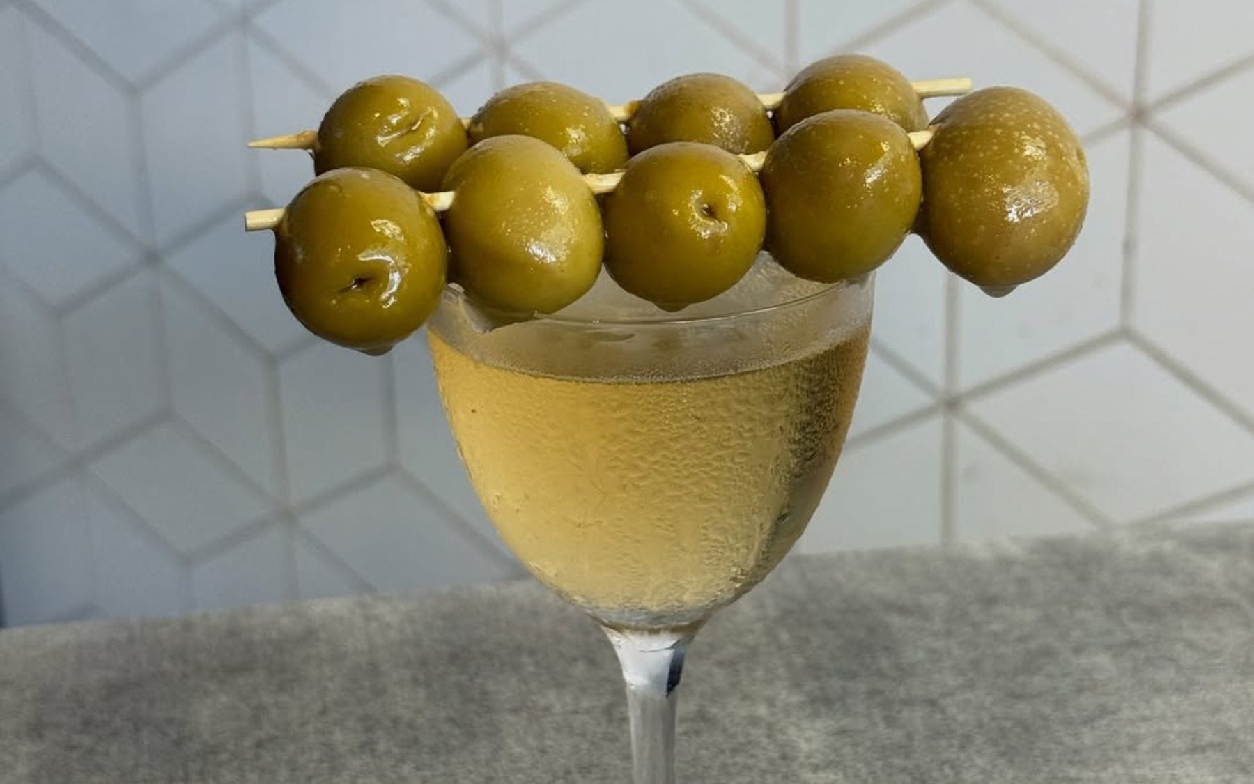 Olive martini with green olives on skewers at Giuls Sydney Girl Dinner deal