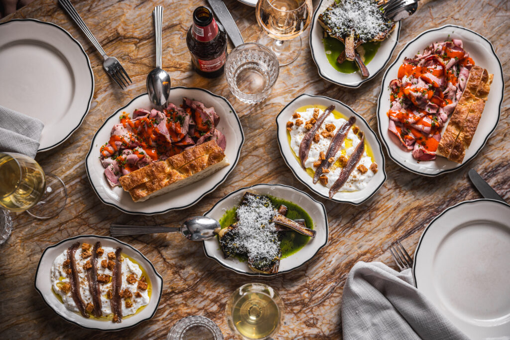 Palatial Pours share plates including ham with colatura hot sauce and artichoke alla griglia at Palazzo Salato Darlinghurst Sydney