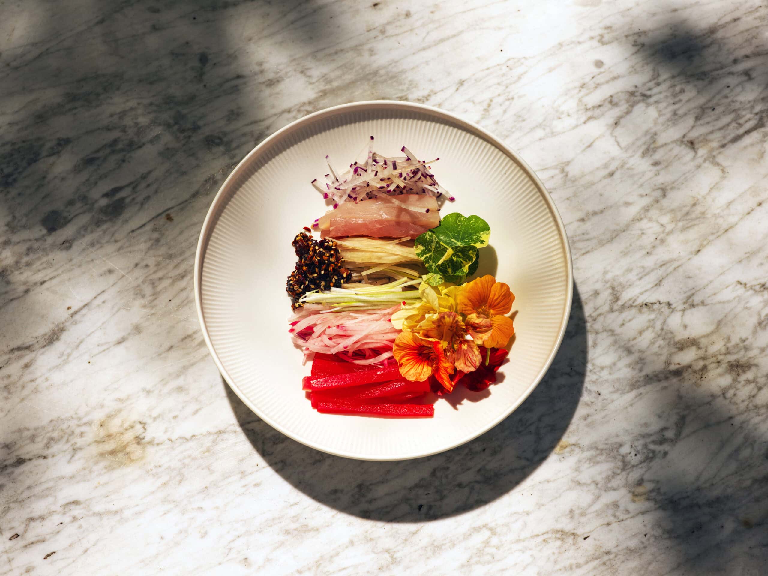 Raw kingfish and tuna salad with Moraea Farm pickles at Sara Dining Berry NSW