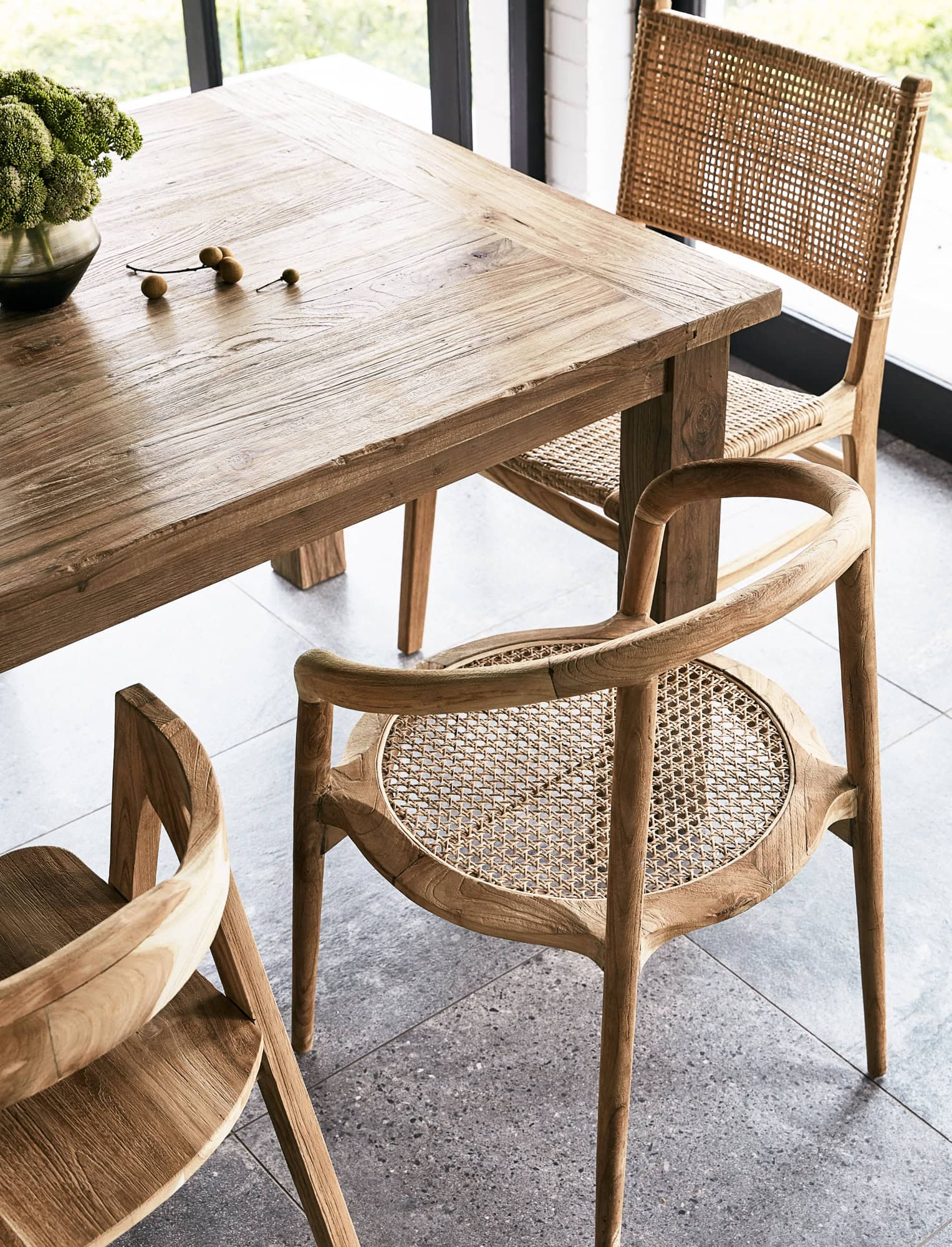 Reclaimed wood dining table with rattan and cane dining chairs by InARTisan archive sale Paddington Sydney