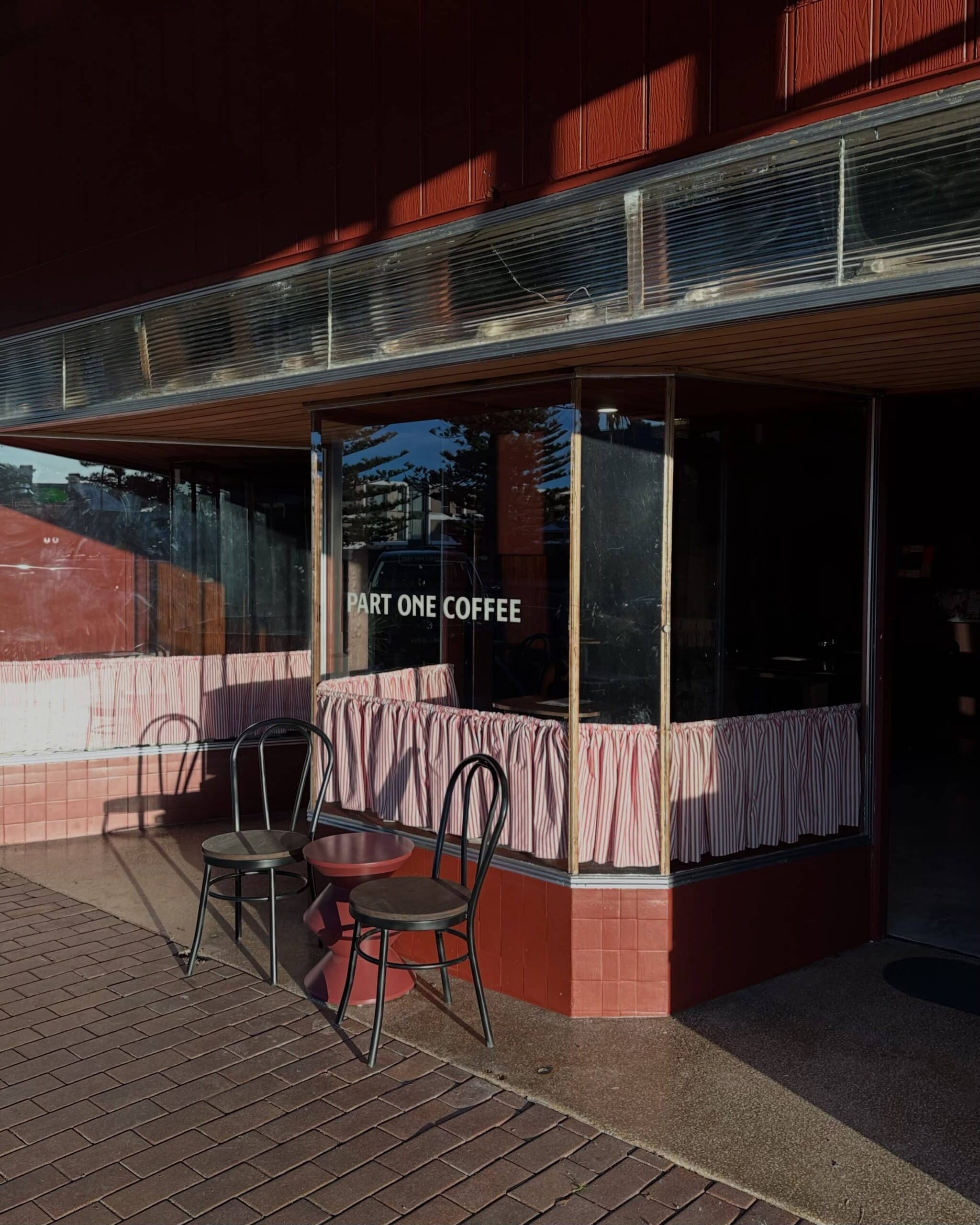 Red brick heritage shopfront exterior at Part One Coffee Kiama