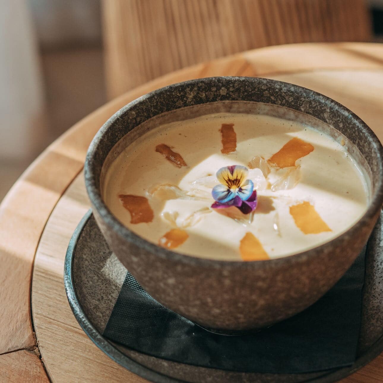 A bowl of sago decorated with edible flowers at Mama Mulan in Chatswood.