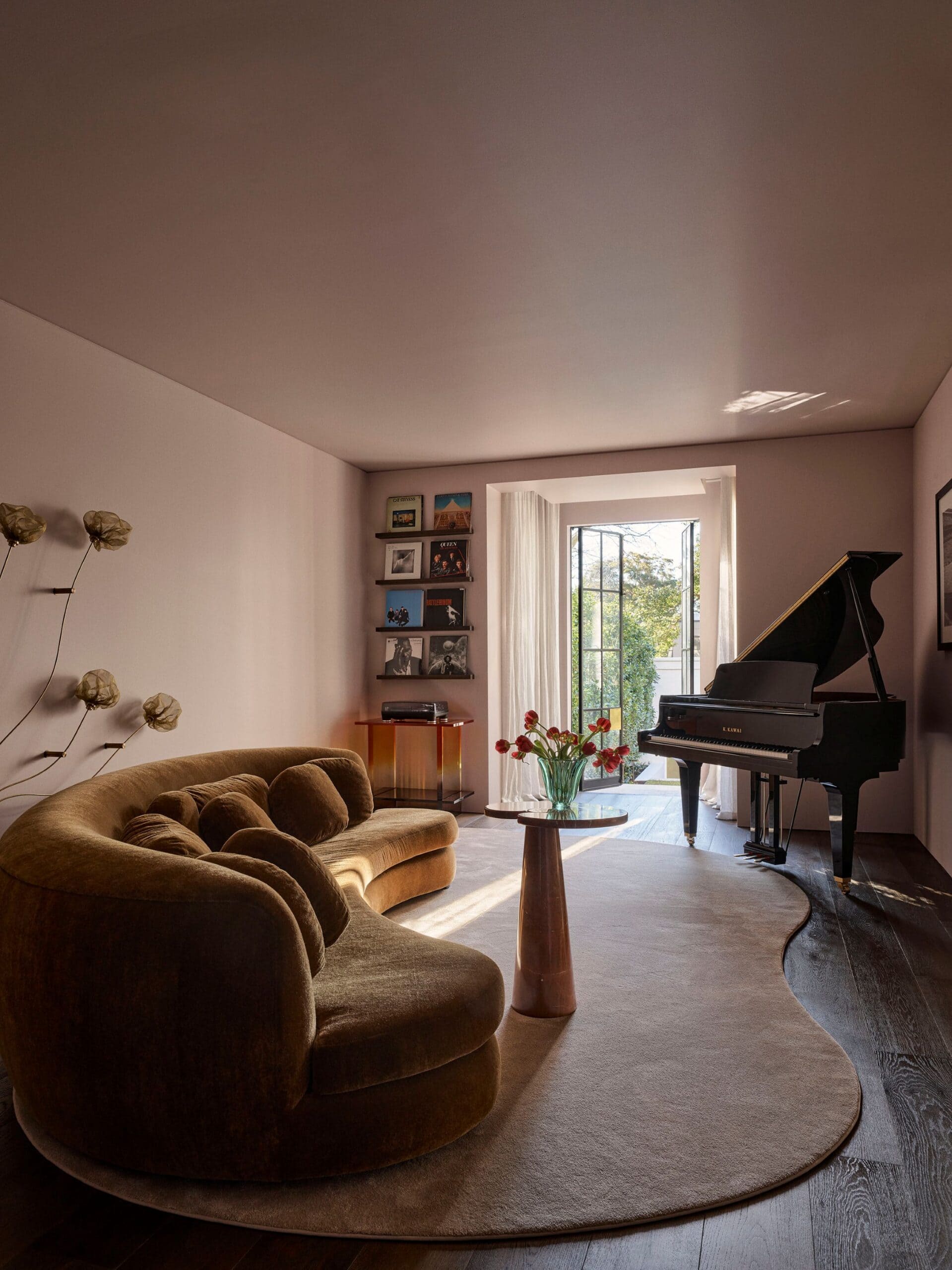 home tour issue 10 2026 living room with piano and orange couch